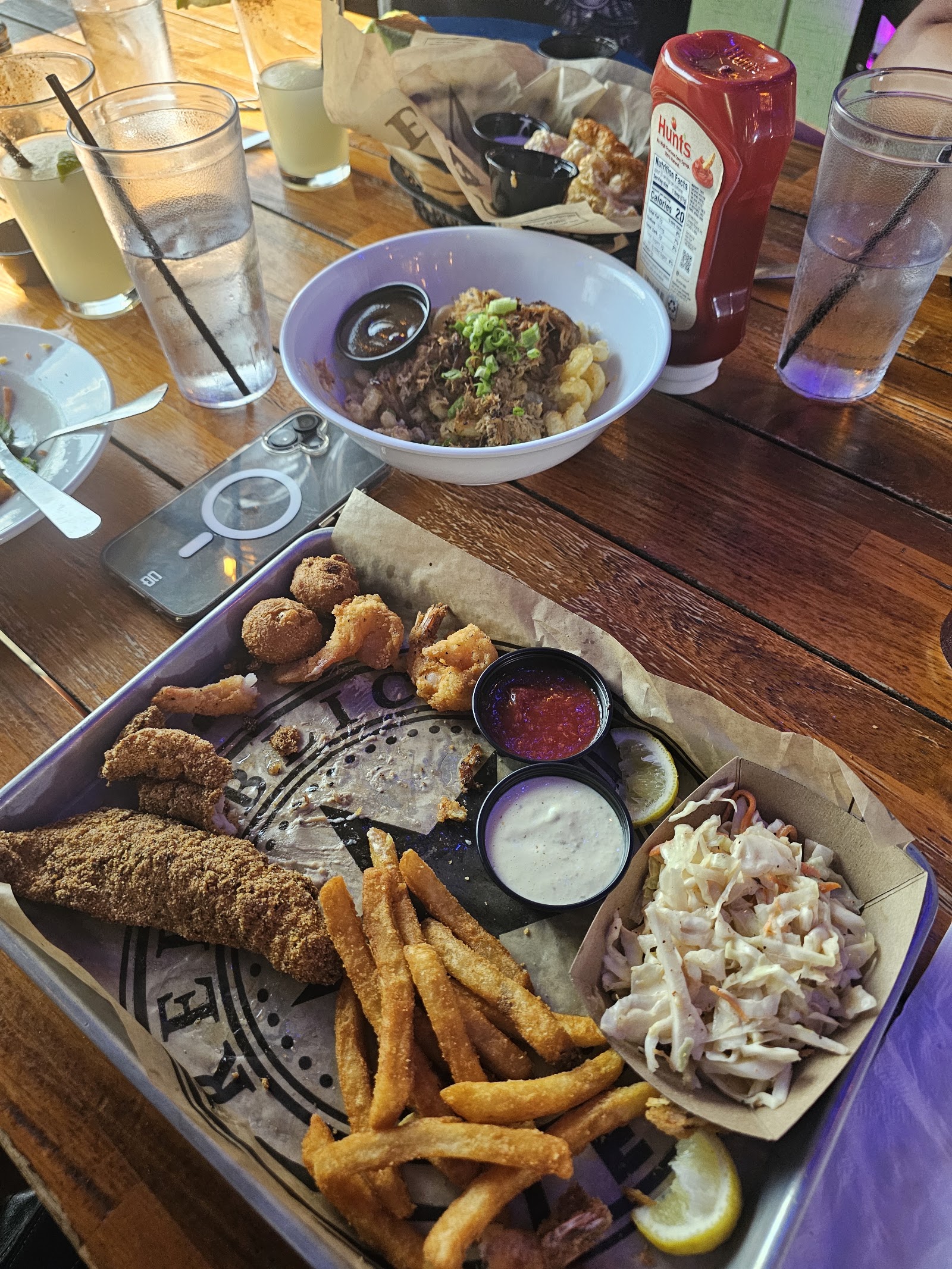 Fried seafood platter with shrimp, catfish, coleslaw and fries